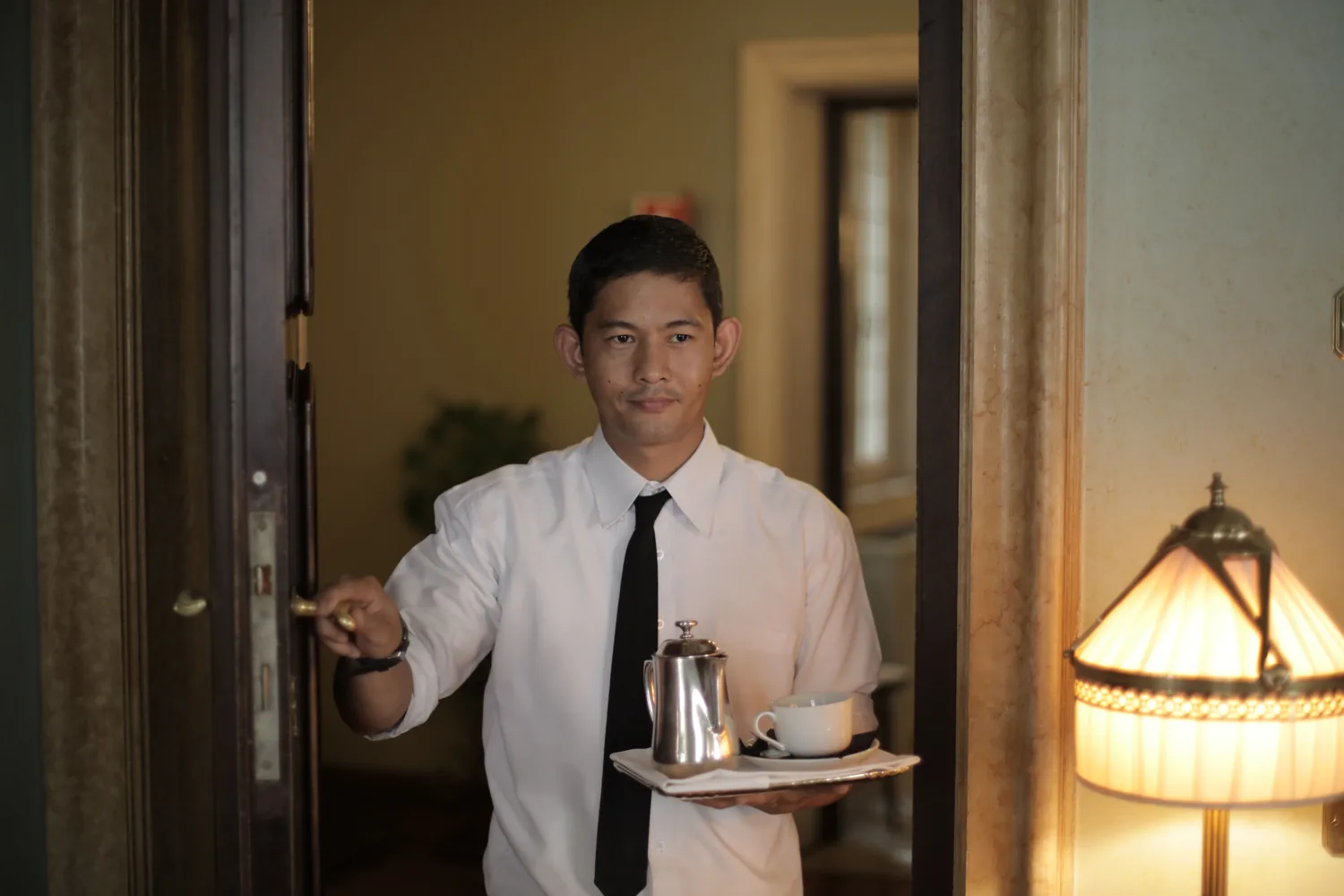 Hospitality professional serving a guest